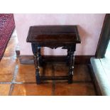 A mid 17th century oak joynt stool, the rectangular seat with moulded edge, plain rails with