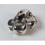 A silver nugget cast from the gripped hand of Felix Dennis, import mark Birmingham 1999, 7cm wide,
