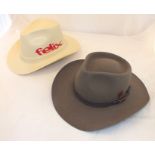 An "Akubra" pure fur felt Snowy River Australian hat, size 61, and a Vulcan protective hard hat in