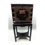 A Japanese Edo period black lacquer cabinet, having double doors, the sides with flowers, bird,