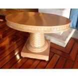 A late 20th century craftsman made oval coffee table, possibly beech, having a carved disc frieze,