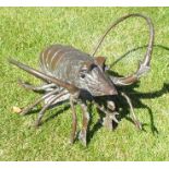 A 20th century bronzed patinated lobster in raised stance, 32cm high