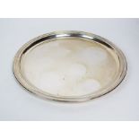 A Tiffany & Co sterling silver tray, of plain polished circular form, stamped to the reverse ‘