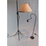 A wrought metal adjustable standard reading lamp, with plain cream shade, together with an