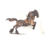 Tony Evans A soldered sheet copper statue of a galloping heavy horse, mane, tail and feathers