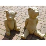 Two pre-cast garden figures of seated bears, height 38cm and 40cm