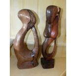 Two carved wooden stylized figures, to include a mermaid on a plinth base, 39cm high