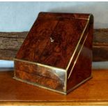 A Victorian figured walnut stationery box with brass bound edges, the carriage top hinged over