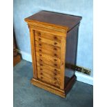 A Victorian walnut collector's cabinet in the form of a miniature Wellington chest, the