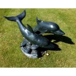 A 20th century bronze sculpture of a pair of leaping dolphins, on sea scroll base, 48cm high