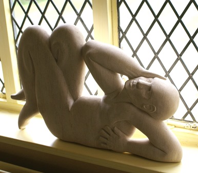 Peter Wright (1919-2003) A stone sculpture, reclining male nude, 66cm wide by 43cm high illustrated