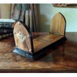 A Victorian walnut and ebonised book stand, with lancet ends with appliqué brass mounts, 50cm