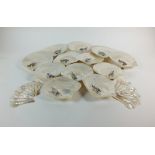 A set of twelve silver mounted mother of pearl shell oyster/hors d’oeuvres dishes, Sheffield