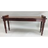 A George IV mahogany plain rectangular hall bench, with rouleau moulded ends, raised on ring