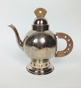 A French silver plated teapot, of circular form with textured patterned decoration, with pierced