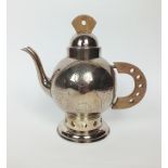 A French silver plated teapot, of circular form with textured patterned decoration, with pierced