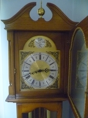 A modern oak finished longcase clock, with brass dial and silvered chapter ring, bearing the - Image 2 of 2