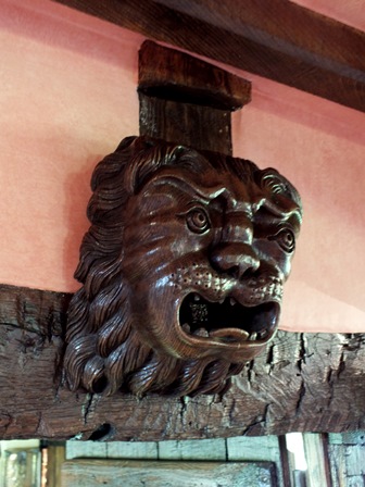 A 19th century carved oak mask of a lion, probably English, 36cm by 26cm illustrated