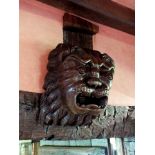 A 19th century carved oak mask of a lion, probably English, 36cm by 26cm illustrated
