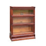 A "Globe Wernicke" mahogany three tier bookcase, with drawer to base, 86cm wide, 120cm high