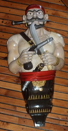 A 20th century carved wood and painted ship's figure head in the form of a Pirate wearing a red - Image 2 of 7