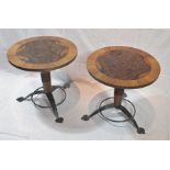 A pair of "Michael Reed Design" of London wine tables, having quarter veneered burr tops, on ring