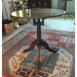 A mid 18th century provincial oak circular tripod table, the triple plank top with bird cage