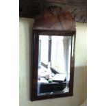 A William and Mary style walnut rectangular wall mirror, the cushion moulded frame with cock-