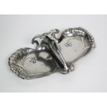 A silver plated Art Nouveau serving platter, of shaped oval form with tendril decoration and figural