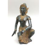 A 20th century bronze Far Eastern female dancer, kneeling with drum, partial gilt costume, with head