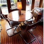 A maple veneer topped circular folding dining table, 1.06m diameter, together with a "Cadman" inlaid