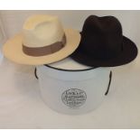 A Lock & Co. Hatters, St James St., London, brown felt Trilby hat size 60 (7 3/8) and a straw Panama