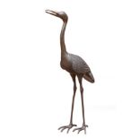 A 20th century bronze crane, standing with beak open, 1.54m tall Illustrated