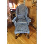 A Queen Anne design wing back easy chair, upholstered in a blue moquette fabric with loose seat