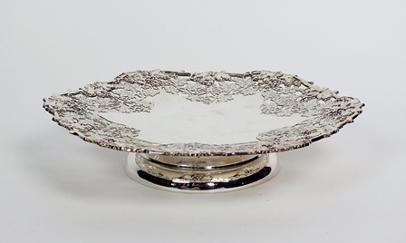 A pedestal silver platter, Henry Atkin, Sheffield 1957, of shaped circular form with vine and