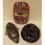 A Nigerian Igbo mask, a Ghanaian mask and a Guatamalan beaded mask (3)