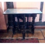 A late 17th century oak rectangular gateleg table of small proportions, the plain top, arched end