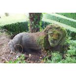 A carved stone recumbent lion after the antique, 110cm wide, 60cm high