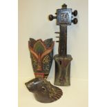 A Sumatran rhino mask, a Balinese stringed instrument and an Indonesian mask (3)