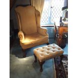 A George I walnut winged armchair, with high serpentine back, button padded squab cushion seat, on
