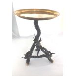 A Colonial occasional table with dished brass top, on a frame made of horns (possibly Ibex), the top