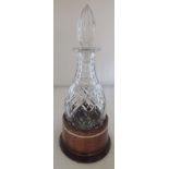 A 20th century cut crystal decanter with stopper, having rounded mallet base, with own turned