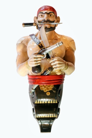 A 20th century carved wood and painted ship's figure head in the form of a Pirate wearing a red