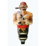 A 20th century carved wood and painted ship's figure head in the form of a Pirate wearing a red