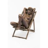 Desmond Fountain (b.1946) A bronze statue "Scorcher" of a young nude woman asleep in a deck chair,