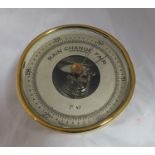 A "Taylor" of Rochester, New York, brass cased compensated barometer, with ring suspension, 13cm