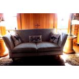 A late 20th century Knole style sofa, oak framed with turned knob decoration, upholstered in white