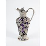 An early Victorian silver mounted amethyst glass claret jug, Charles Reily and George Storer, London