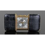 Movado ermetophon leather and gilt metal purse watch, the silvered dial with gilt metal case,