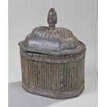 18th Century lead tobacco box, with figural finial top above a gadrooned led and conforming body,